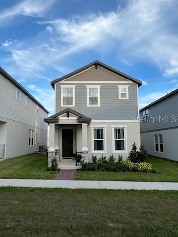 view of property featuring a front yard