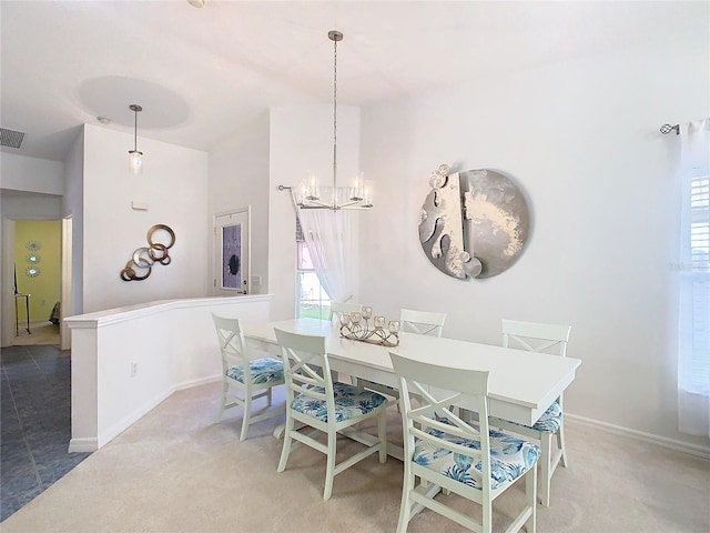 dining room with carpet flooring, an inviting chandelier, and a healthy amount of sunlight