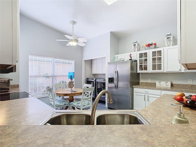 kitchen featuring high vaulted ceiling, sink, ceiling fan, appliances with stainless steel finishes, and white cabinetry