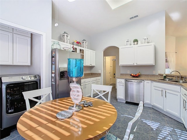 kitchen featuring sink, white cabinets, and appliances with stainless steel finishes