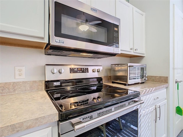 kitchen with white cabinets and stainless steel appliances