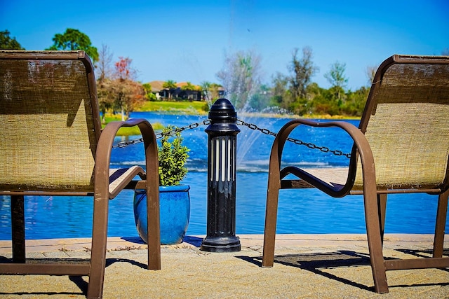 view of pool with a water view