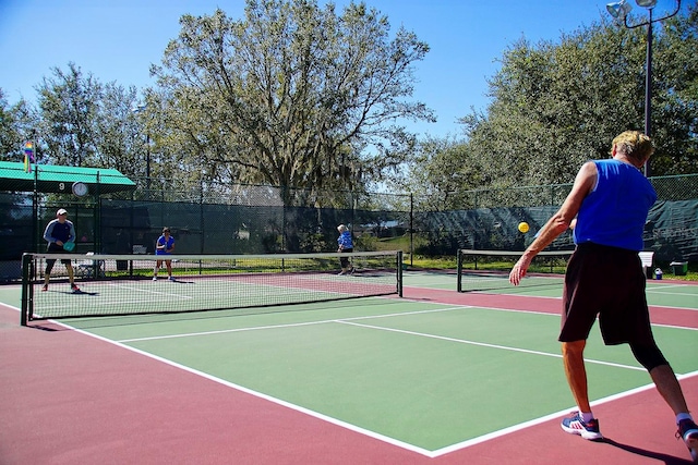 view of tennis court featuring basketball court