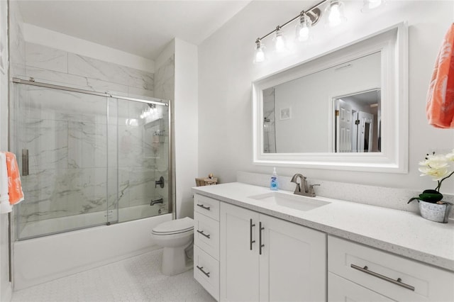 full bathroom with vanity, enclosed tub / shower combo, and toilet