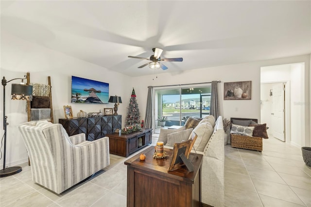 living room with ceiling fan and light tile patterned floors