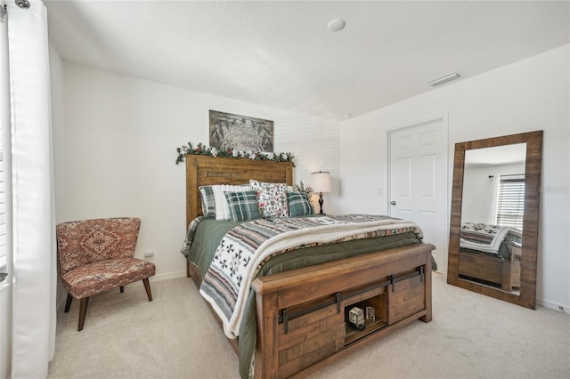 bedroom with light carpet