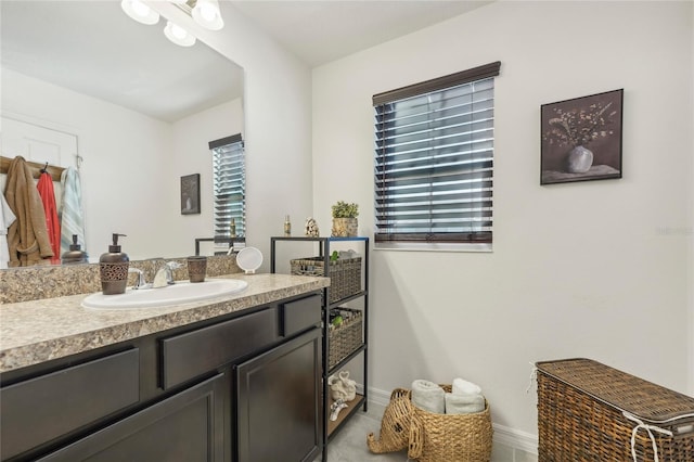 bathroom featuring tile patterned floors and vanity