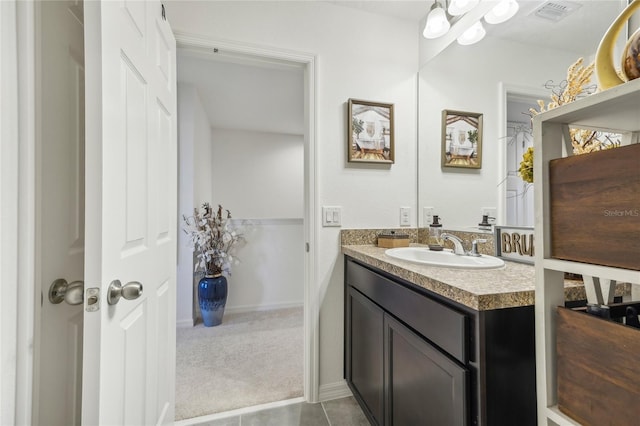 bathroom featuring tile patterned floors and vanity