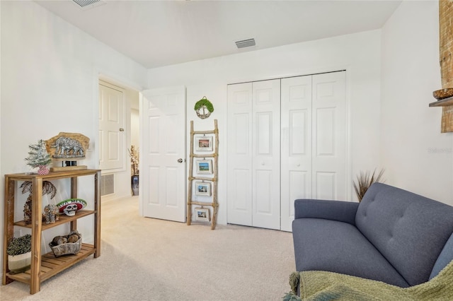 living area featuring carpet floors