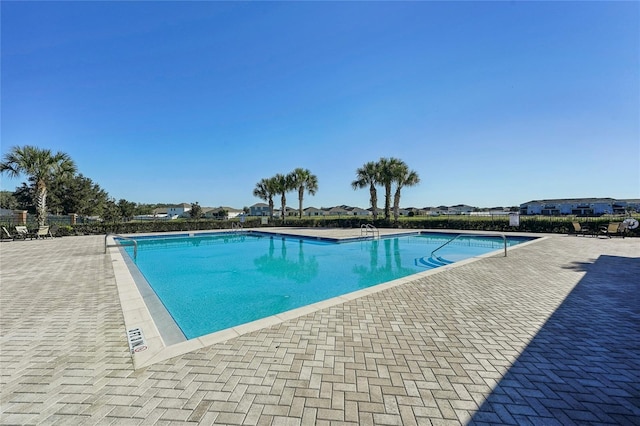 view of swimming pool featuring a patio