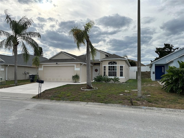 ranch-style house with a front yard and a garage