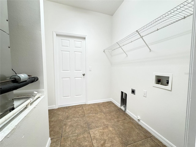 laundry room featuring tile patterned floors, washer hookup, and hookup for an electric dryer