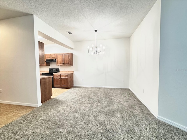 kitchen with black electric range oven, light carpet, decorative light fixtures, a textured ceiling, and a notable chandelier