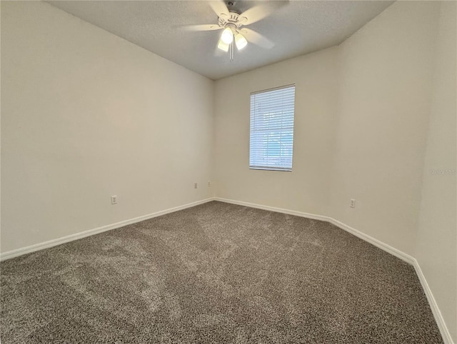 carpeted empty room featuring a textured ceiling and ceiling fan