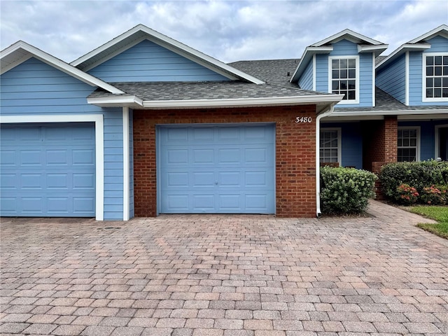 view of front of property with a garage