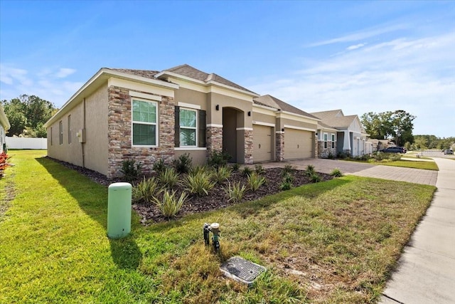 view of front facade featuring a front yard and a garage