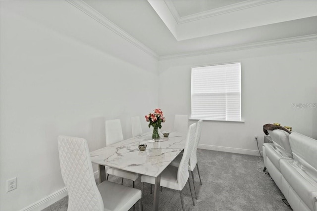 dining area with carpet flooring and crown molding