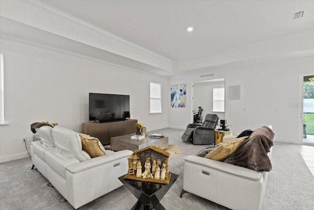 living room with light carpet and ornamental molding