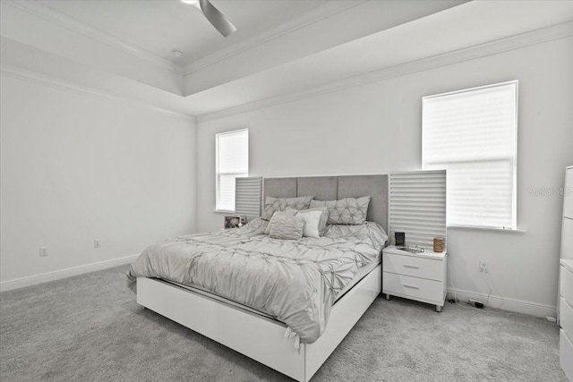 bedroom featuring ceiling fan, crown molding, and light carpet