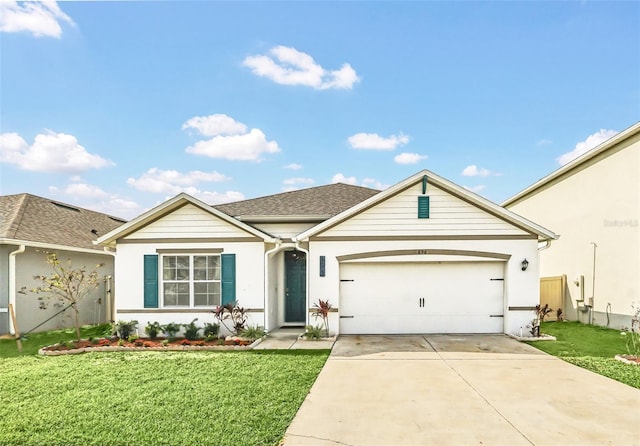 ranch-style home featuring a garage and a front lawn