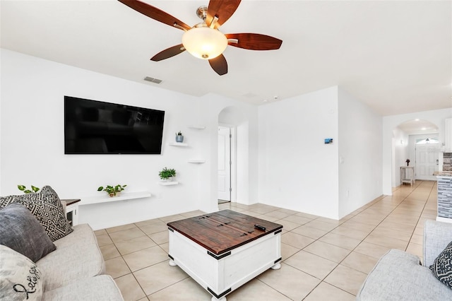 living room with ceiling fan and light tile patterned flooring