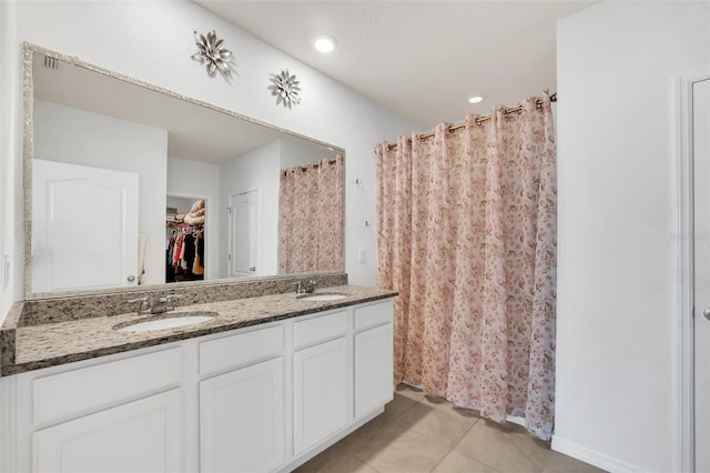 bathroom with tile patterned floors and vanity