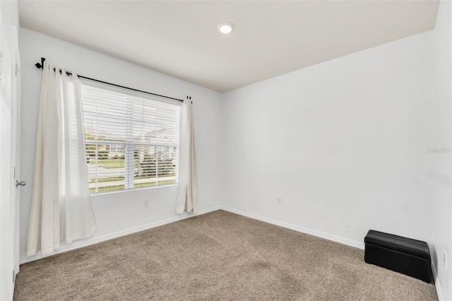 unfurnished room with carpet floors