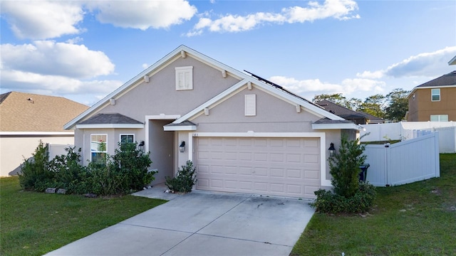 view of front facade featuring a front yard and a garage