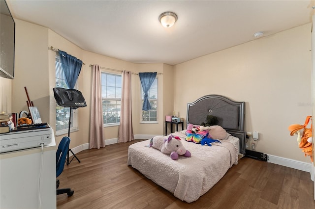 bedroom featuring wood-type flooring