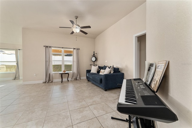 living room with ceiling fan and light tile patterned floors