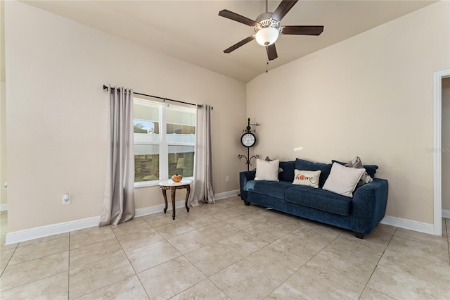 sitting room featuring ceiling fan, light tile patterned floors, and vaulted ceiling