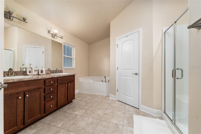 bathroom with tile patterned floors, vanity, and plus walk in shower