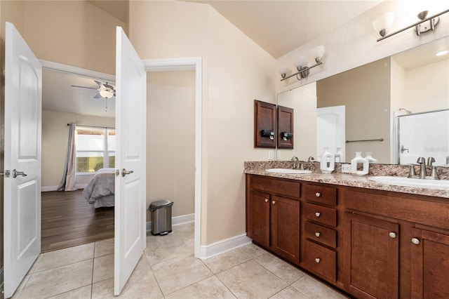 bathroom featuring ceiling fan, a shower, hardwood / wood-style floors, lofted ceiling, and vanity