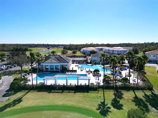 view of swimming pool with a yard and a patio