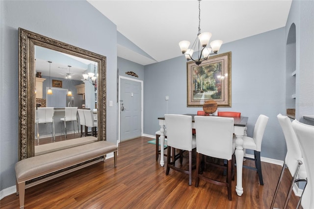 dining room featuring lofted ceiling, a chandelier, and dark hardwood / wood-style floors