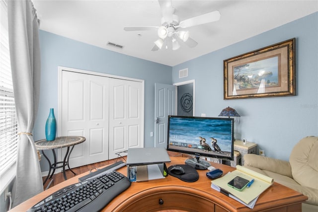 office featuring hardwood / wood-style floors and ceiling fan