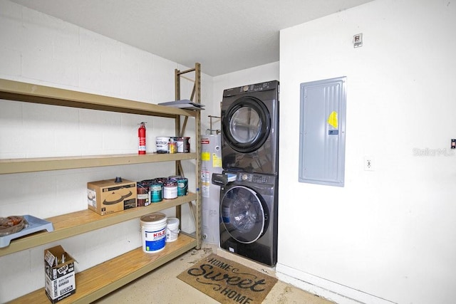 washroom with electric panel and stacked washer and clothes dryer