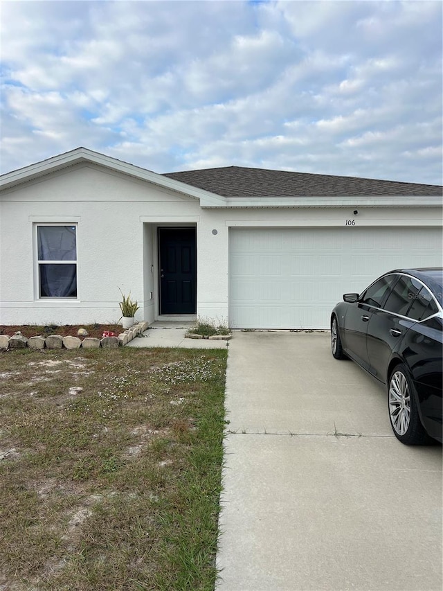 ranch-style house featuring a garage