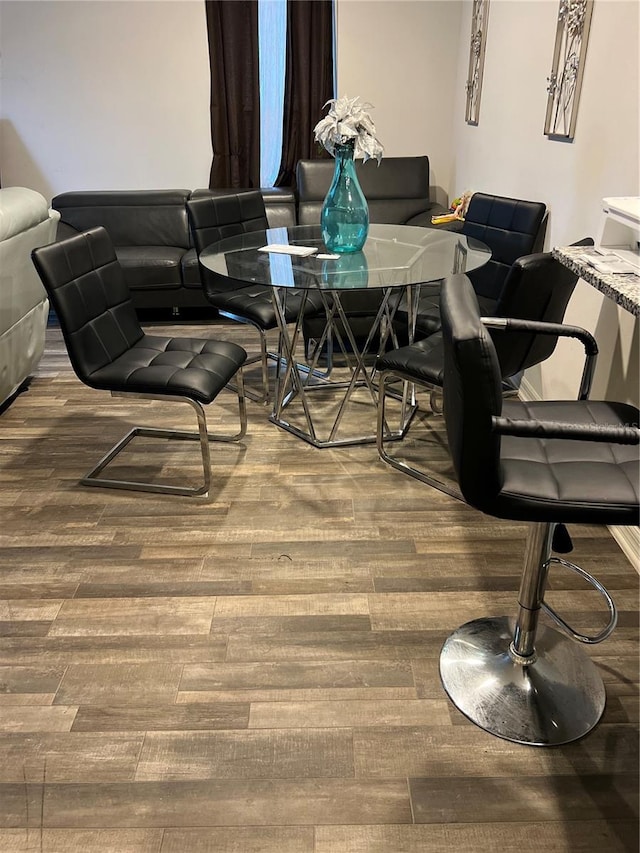 dining space featuring hardwood / wood-style floors