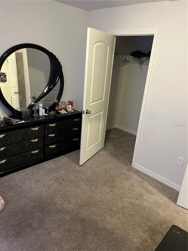 carpeted bedroom with a closet