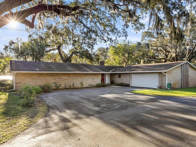 single story home featuring a garage