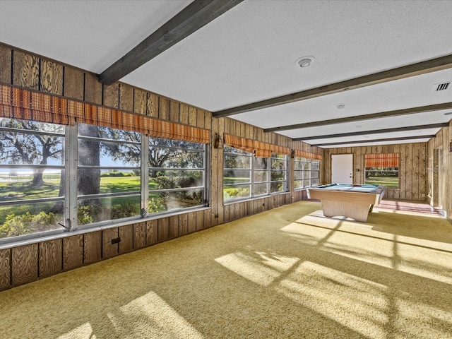 unfurnished sunroom with beamed ceiling and billiards