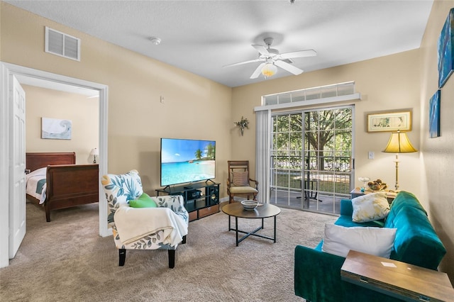 living room with ceiling fan and light carpet