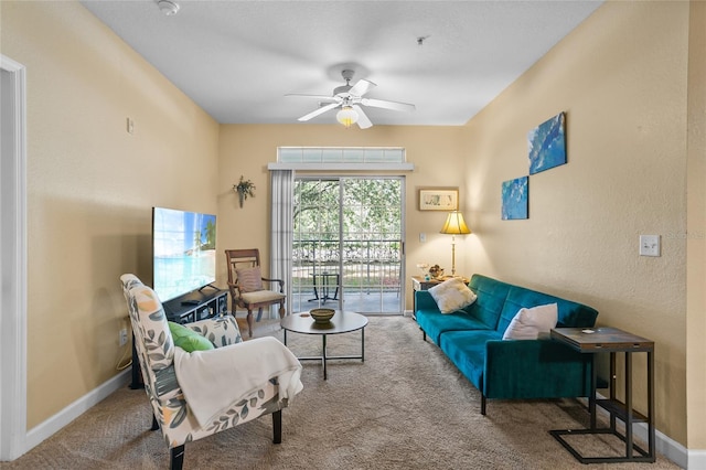 living room featuring carpet flooring and ceiling fan