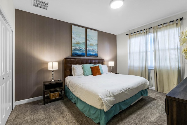 bedroom with carpet flooring and a closet