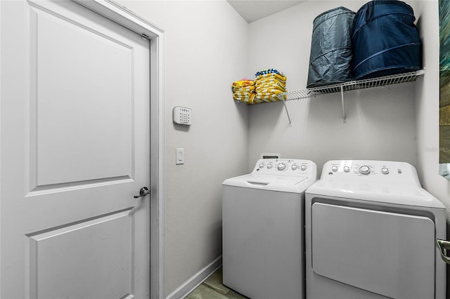 laundry area with independent washer and dryer