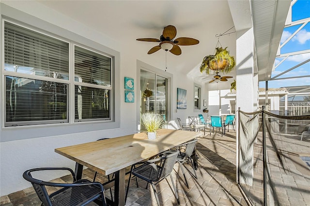 exterior space featuring a lanai, a patio area, and ceiling fan