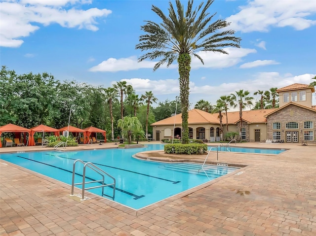 view of swimming pool with a patio area