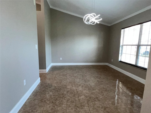 empty room featuring a chandelier, ornamental molding, and vaulted ceiling