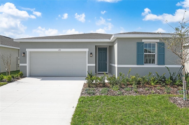 ranch-style house with a garage and a front lawn